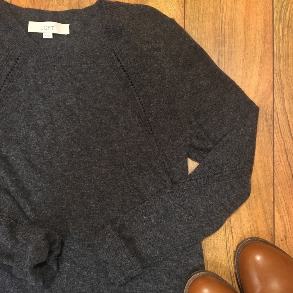 Classic grey crew-neck sweater.